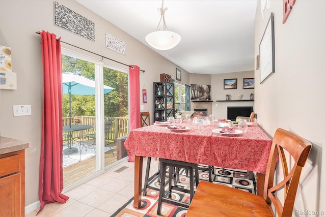 5304 Boomerang Cir, Newport, MI 48166 - dining room featuring a fireplace, plenty of natural light, and light tile patterned floors