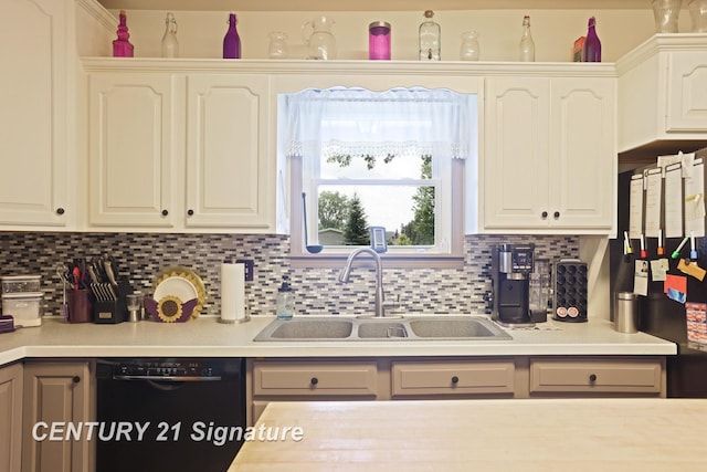 3405 S Miller Rd, Saginaw, MI 48609 - kitchen with dishwasher, light countertops, tasteful backsplash, freestanding refrigerator, and white cabinetry
