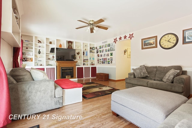 3405 S Miller Rd, Saginaw, MI 48609 - living room featuring ceiling fan, wood finished floors, and a glass covered fireplace