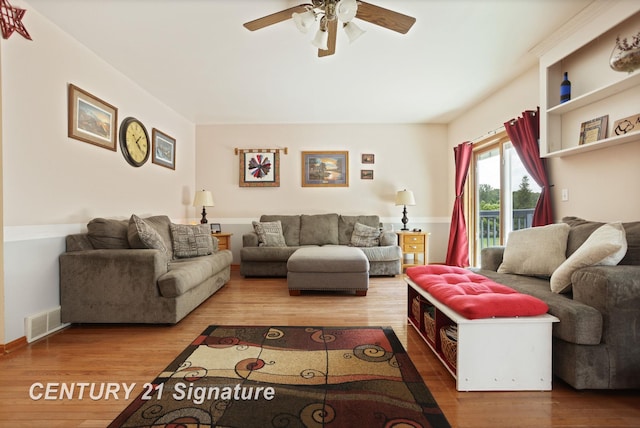 3405 S Miller Rd, Saginaw, MI 48609 - living area with a ceiling fan and wood finished floors