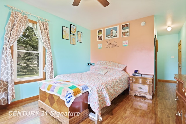 3405 S Miller Rd, Saginaw, MI 48609 - bedroom featuring wood finished floors and ceiling fan