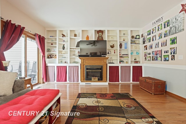 3405 S Miller Rd, Saginaw, MI 48609 - living room featuring wood finished floors and a glass covered fireplace