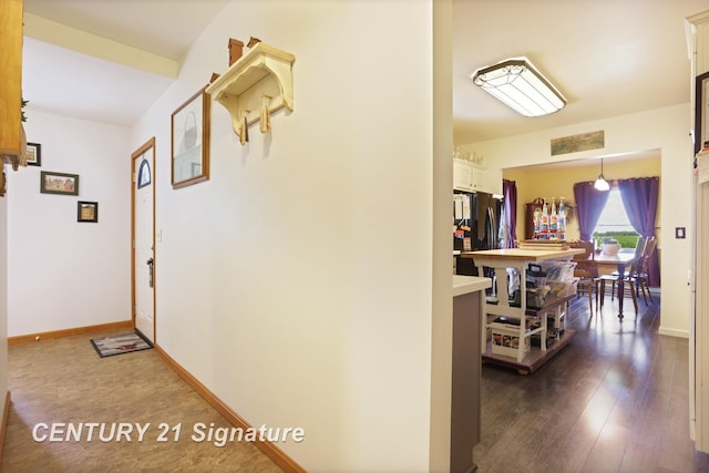 3405 S Miller Rd, Saginaw, MI 48609 - hallway with baseboards and dark wood finished floors