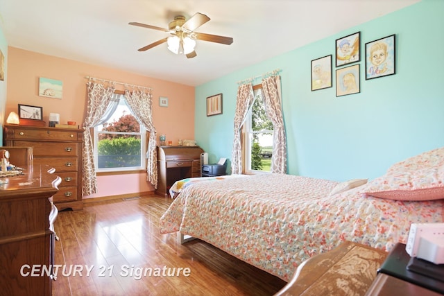 3405 S Miller Rd, Saginaw, MI 48609 - bedroom with wood finished floors and ceiling fan