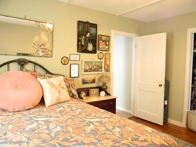 103 S Staffon St, Ludington, MI 49431 - bedroom with wood finished floors and baseboards