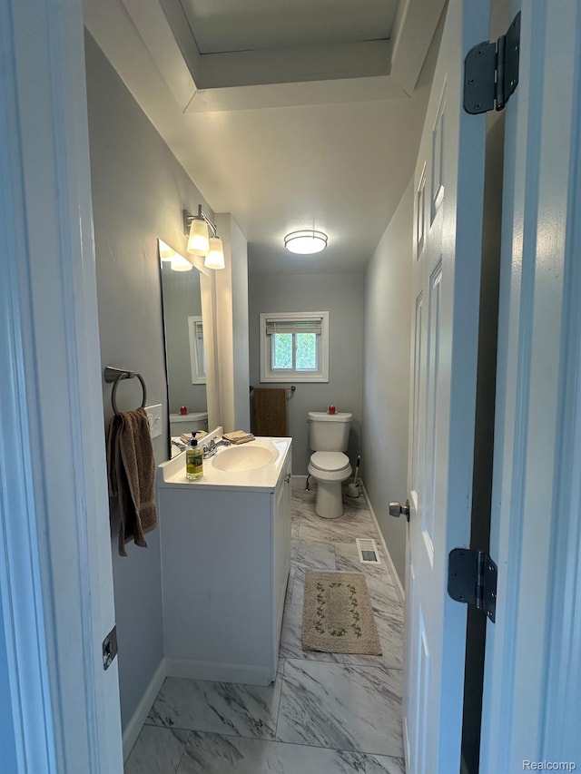 17788 Quarry St, Riverview, MI 48193 - half bathroom featuring vanity, marble finish floors, and a raised ceiling