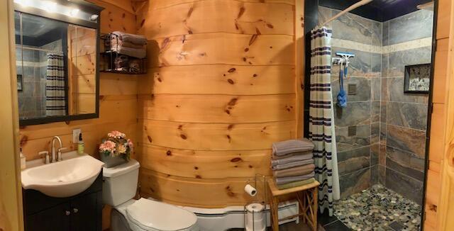777 W Lincoln Ave, White Cloud, MI 49349 - full bathroom with vanity and tiled shower