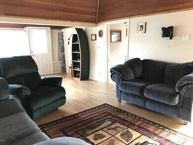 777 W Lincoln Ave, White Cloud, MI 49349 - living area with wood finished floors