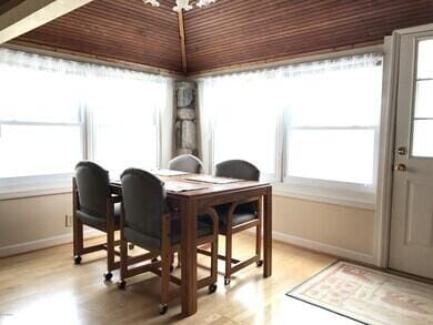 777 W Lincoln Ave, White Cloud, MI 49349 - dining area featuring light wood-style flooring and a chandelier
