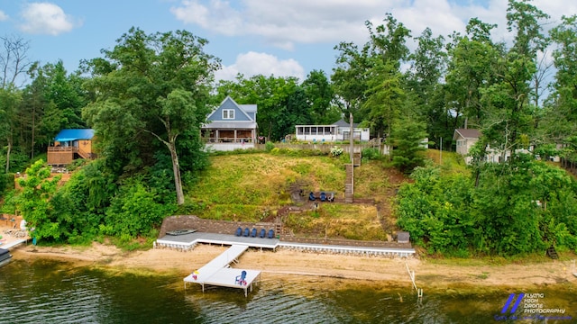 777 W Lincoln Ave, White Cloud, MI 49349 - back of house with a water view and view of scattered trees