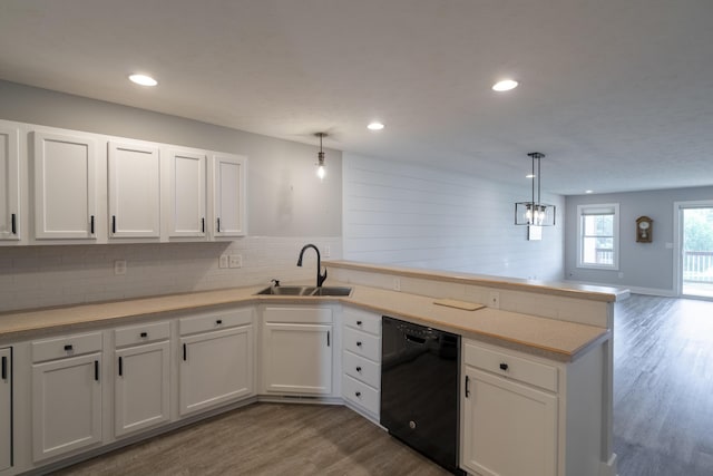 10068 S Crossroads Cir SE, Caledonia, MI 49316 - kitchen featuring black dishwasher, a peninsula, wood finished floors, white cabinets, and recessed lighting