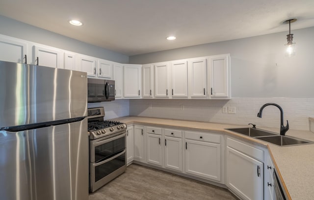 10068 S Crossroads Cir SE, Caledonia, MI 49316 - kitchen with stainless steel appliances, light countertops, white cabinets, backsplash, and recessed lighting