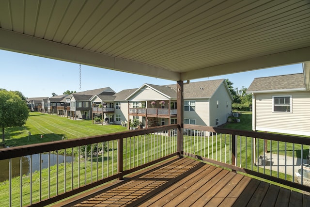 10068 S Crossroads Cir SE, Caledonia, MI 49316 - wooden terrace featuring a residential view and a lawn
