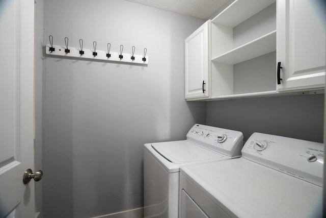 10068 S Crossroads Cir SE, Caledonia, MI 49316 - laundry room with cabinet space and washer and clothes dryer