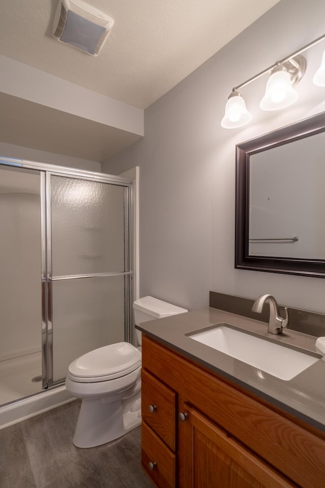 10068 S Crossroads Cir SE, Caledonia, MI 49316 - full bath with vanity, a shower stall, and wood finished floors