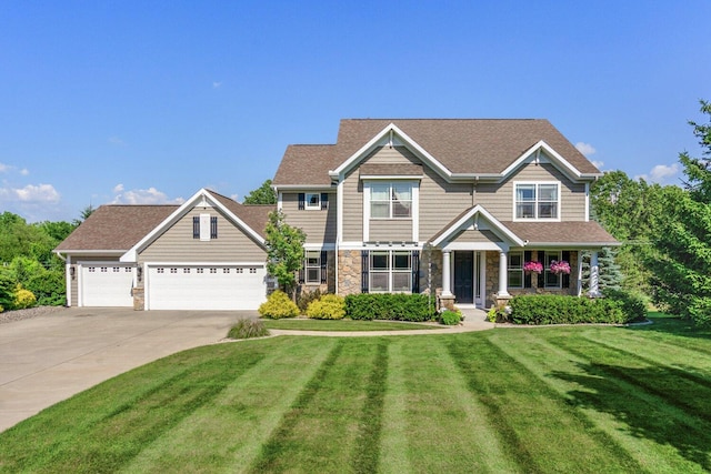 8375 Grapevine Circle, Cir, MI 49071 - craftsman house featuring a front yard, stone siding, driveway, and a garage