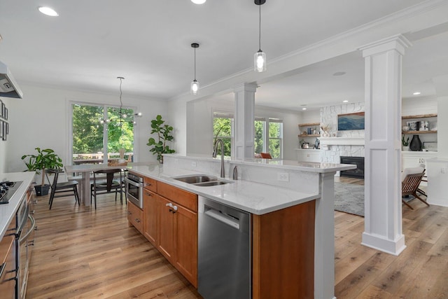 8375 Grapevine Circle, Cir, MI 49071 - kitchen featuring appliances with stainless steel finishes, ornate columns, plenty of natural light, crown molding, and recessed lighting