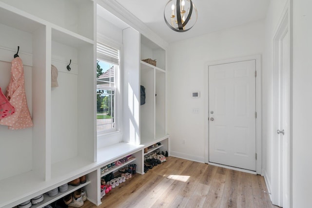 8375 Grapevine Circle, Cir, MI 49071 - mudroom with healthy amount of natural light, a chandelier, and light wood-style flooring