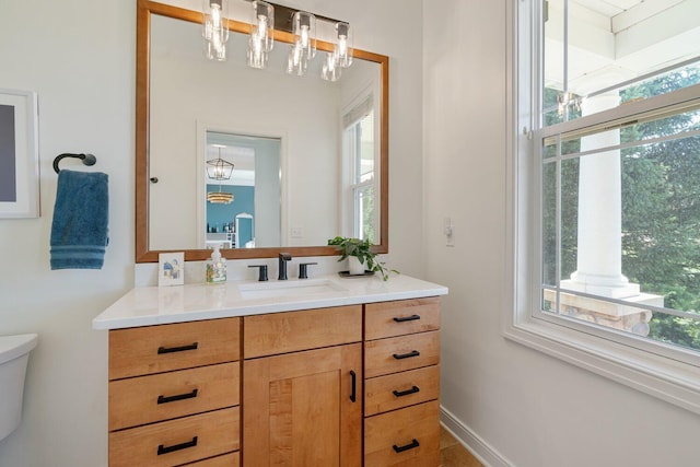 8375 Grapevine Circle, Cir, MI 49071 - bathroom with plenty of natural light, vanity, and a chandelier
