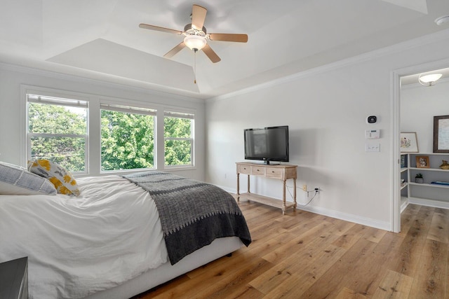 8375 Grapevine Circle, Cir, MI 49071 - bedroom featuring a raised ceiling, light wood-type flooring, ornamental molding, and a ceiling fan