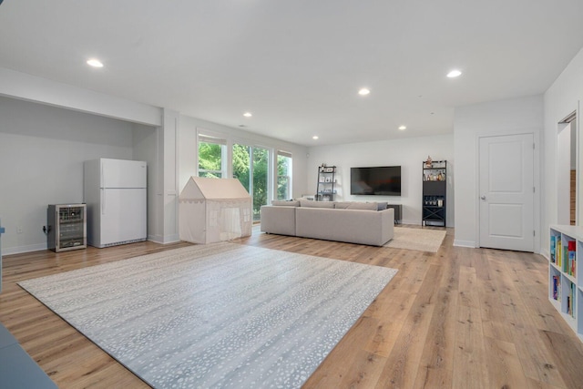 8375 Grapevine Circle, Cir, MI 49071 - living area featuring wine cooler, light wood finished floors, and recessed lighting