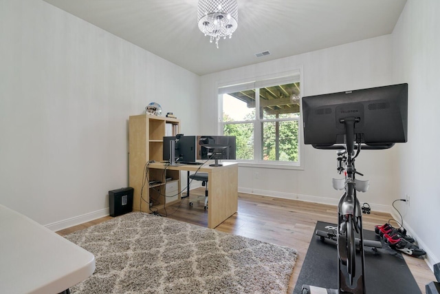 8375 Grapevine Circle, Cir, MI 49071 - office space with wood finished floors and a chandelier