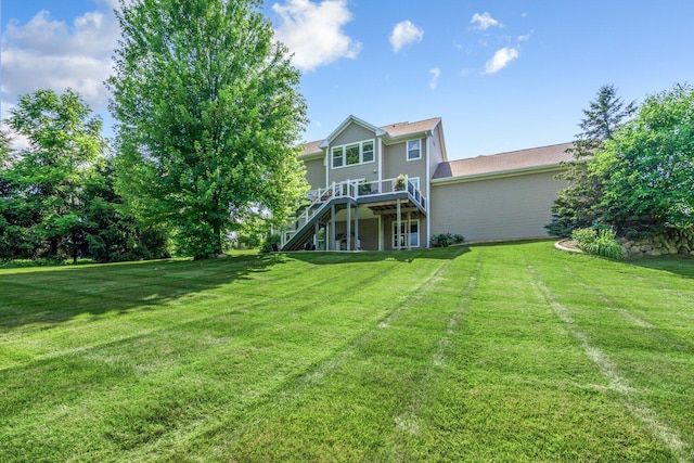 8375 Grapevine Circle, Cir, MI 49071 - rear view of house with stairway, a wooden deck, and a lawn