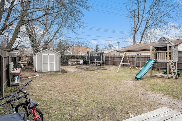 1314 Grant St, Grand Haven, MI 49417 - fenced backyard with a storage shed, a trampoline, and a playground