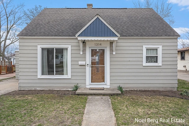 1314 Grant St, Grand Haven, MI 49417 - bungalow-style house with a shingled roof and board and batten siding