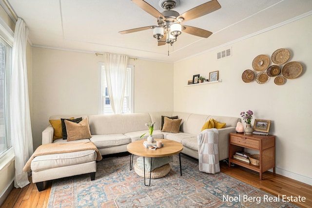 1314 Grant St, Grand Haven, MI 49417 - living area with wood-type flooring, a ceiling fan, and ornamental molding