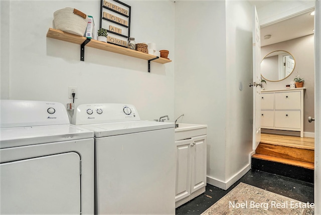 1314 Grant St, Grand Haven, MI 49417 - laundry area with separate washer and dryer and cabinet space