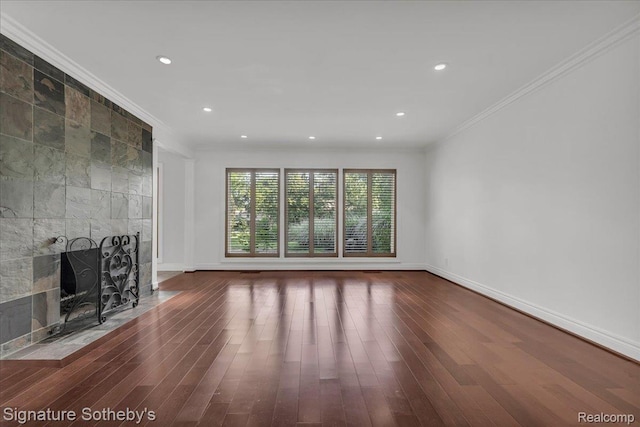 1656 Keller Ln, Bloomfield Hills, MI 48302 - unfurnished living room featuring ornamental molding, wood finished floors, a tile fireplace, and recessed lighting