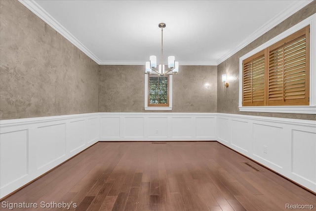 1656 Keller Ln, Bloomfield Hills, MI 48302 - empty room with a chandelier, dark wood-style flooring, a wainscoted wall, ornamental molding, and a decorative wall