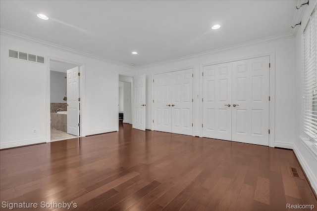1656 Keller Ln, Bloomfield Hills, MI 48302 - unfurnished bedroom with two closets, wood finished floors, crown molding, recessed lighting, and ensuite bathroom