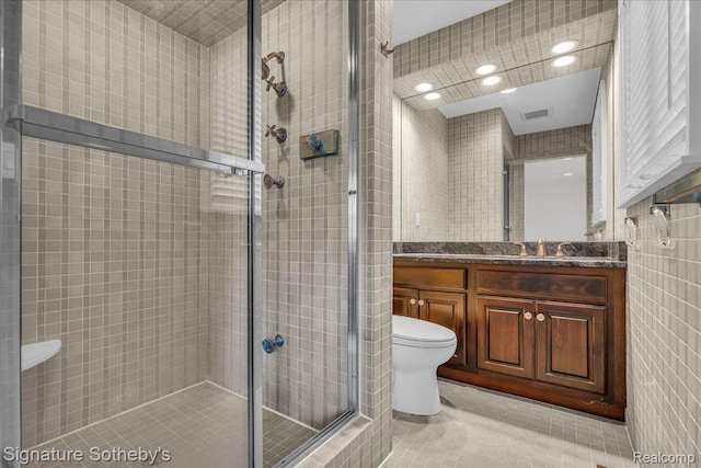 1656 Keller Ln, Bloomfield Hills, MI 48302 - full bath featuring tile patterned floors, a shower stall, vanity, tile walls, and recessed lighting