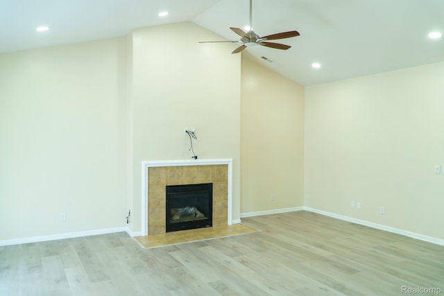 1803 Pinecroft Dr, Canton, MI 48188 - unfurnished living room with ceiling fan, light wood-style flooring, recessed lighting, vaulted ceiling, and a tiled fireplace