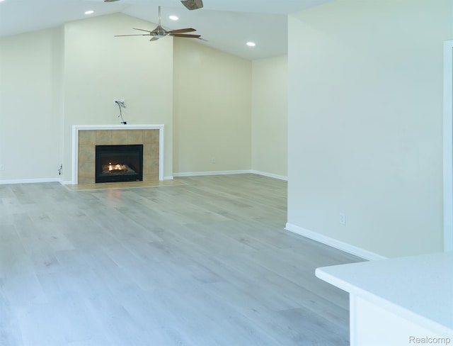 1803 Pinecroft Dr, Canton, MI 48188 - unfurnished living room featuring a tile fireplace, ceiling fan, light wood finished floors, recessed lighting, and high vaulted ceiling