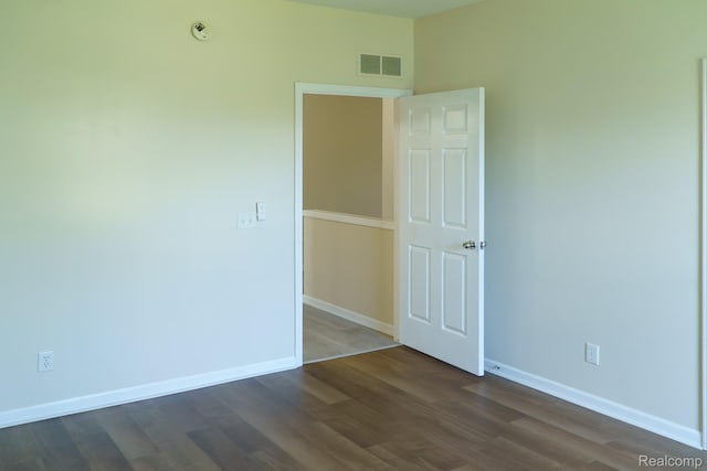 1803 Pinecroft Dr, Canton, MI 48188 - spare room featuring dark wood-type flooring and baseboards