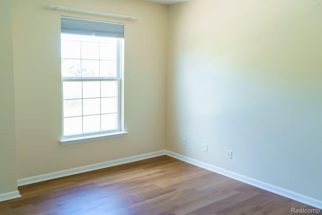 1803 Pinecroft Dr, Canton, MI 48188 - unfurnished room with wood finished floors and baseboards