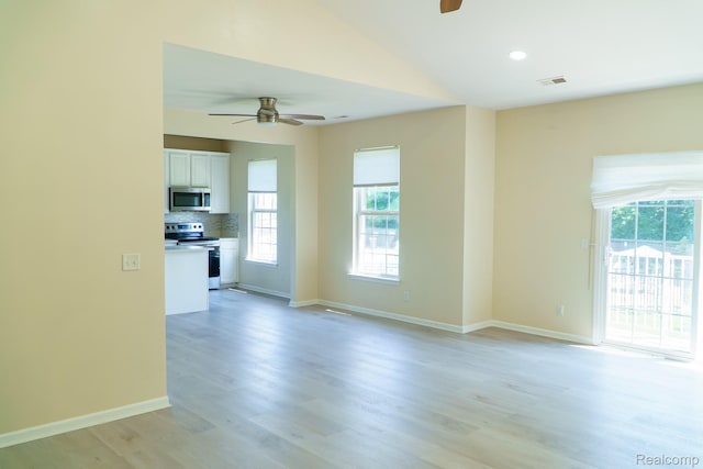 1803 Pinecroft Dr, Canton, MI 48188 - unfurnished living room with a ceiling fan, light wood-style flooring, and vaulted ceiling