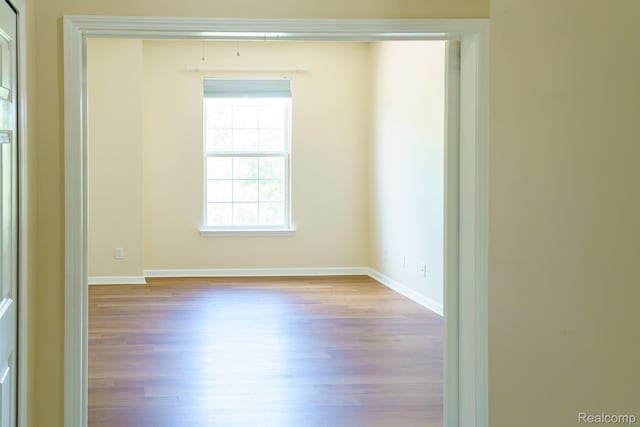 1803 Pinecroft Dr, Canton, MI 48188 - unfurnished room with wood finished floors and baseboards