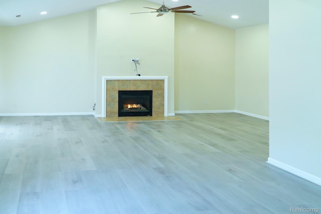 1803 Pinecroft Dr, Canton, MI 48188 - unfurnished living room with ceiling fan, a fireplace, light wood-style floors, recessed lighting, and vaulted ceiling