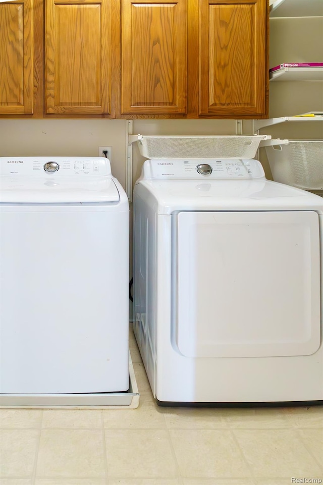1803 Pinecroft Dr, Canton, MI 48188 - laundry room with cabinet space and washing machine and clothes dryer