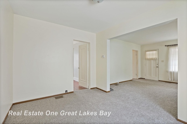 2249 N Clinton St, Saginaw, MI 48602 - unfurnished room featuring carpet flooring and baseboards