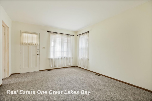 2249 N Clinton St, Saginaw, MI 48602 - empty room with carpet and baseboards