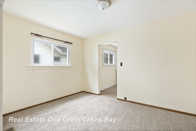 2249 N Clinton St, Saginaw, MI 48602 - carpeted empty room featuring baseboards