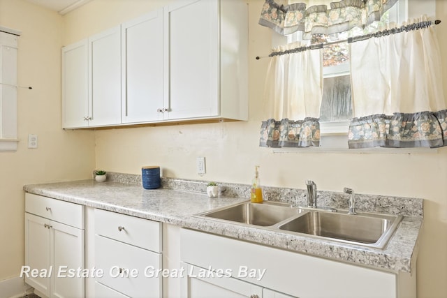 2249 N Clinton St, Saginaw, MI 48602 - kitchen featuring white cabinetry and light countertops