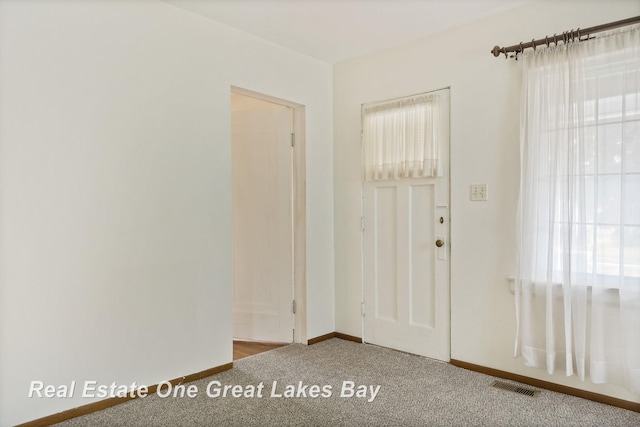 2249 N Clinton St, Saginaw, MI 48602 - carpeted entrance foyer with baseboards