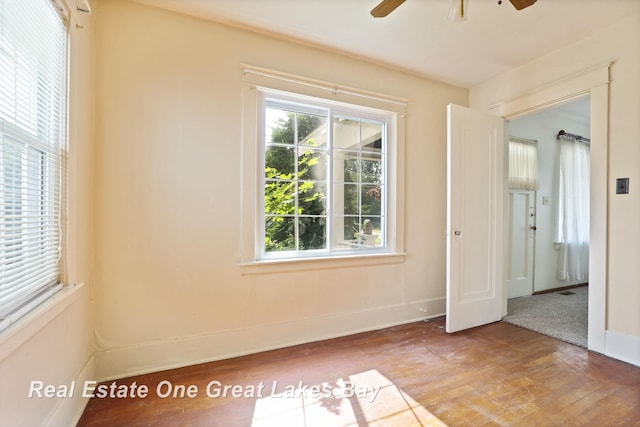 2249 N Clinton St, Saginaw, MI 48602 - unfurnished room with wood finished floors and ceiling fan