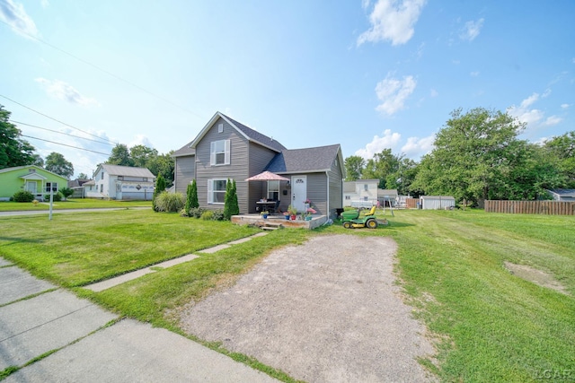 424 W Summit St, Adrian, MI 49221 - view of front facade with driveway and a shingled roof